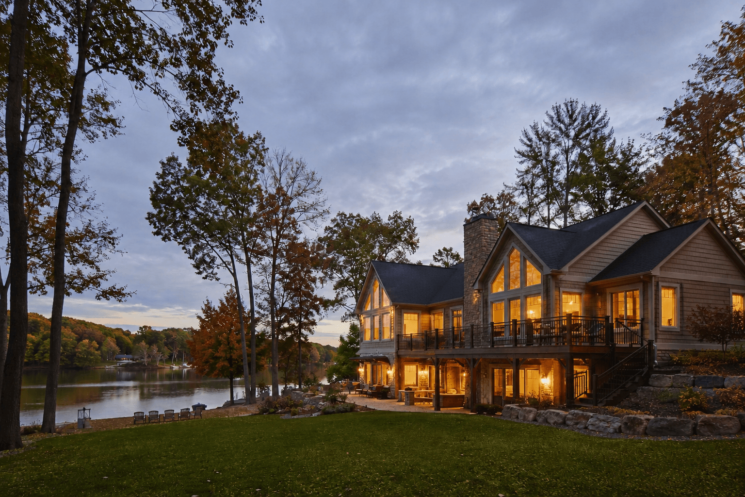 Wisconsin lakefront home at dusk, autumn foliage and lit interior
